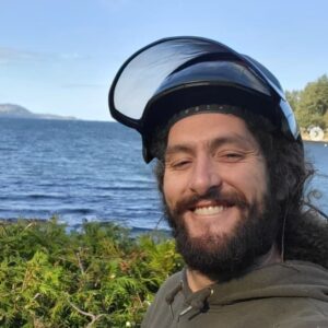 photo of Neighbourhood Tree Service owner Joe Doran Nanaimo trimming trees by ocean