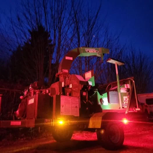 large mobile wood chipper at night